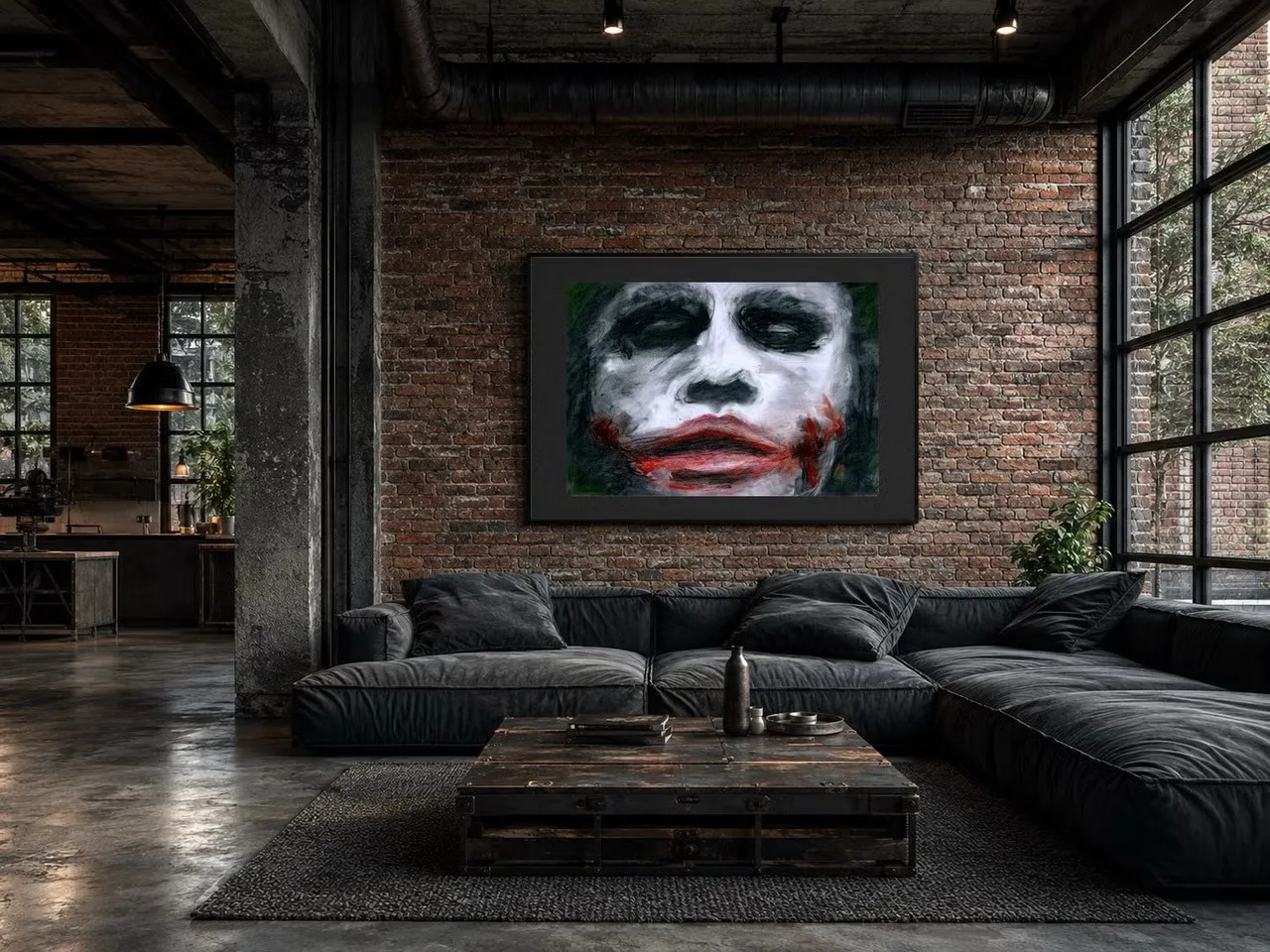 A raw painted face in white, black and red, hung in a black frame on an exposed brick wall in an industrial loft.